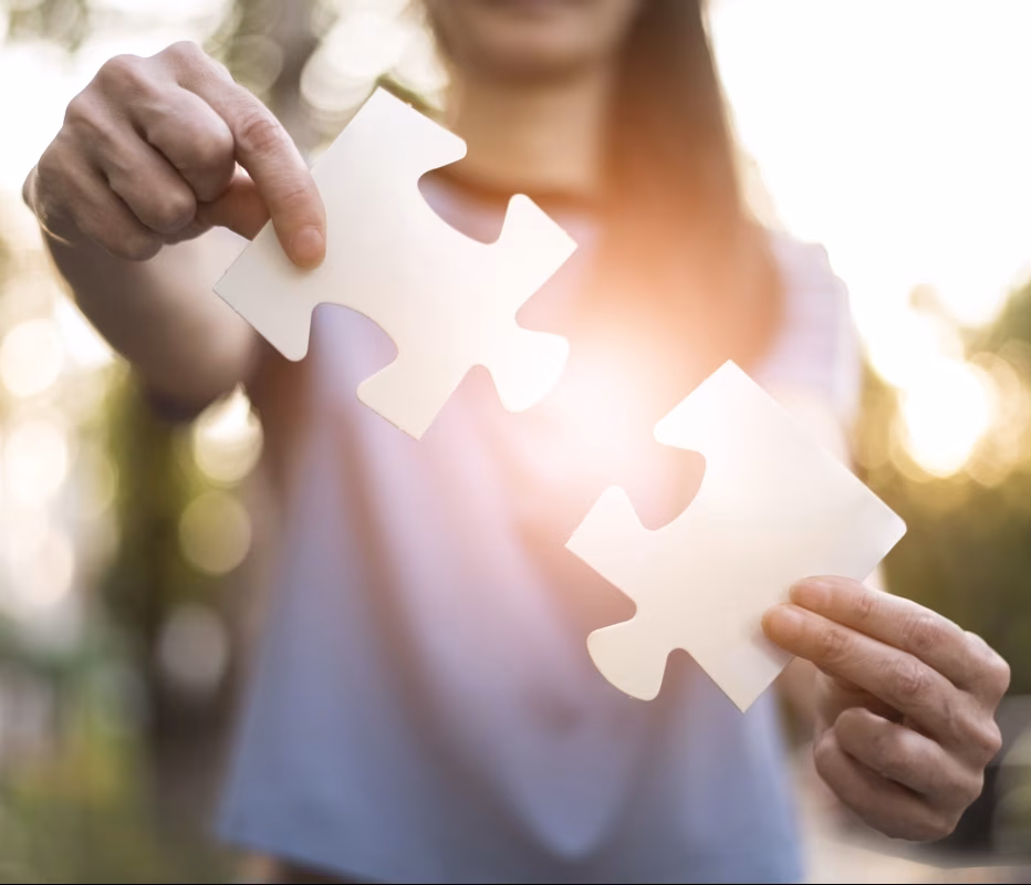 front-view-woman-holding-puzzle-pieces